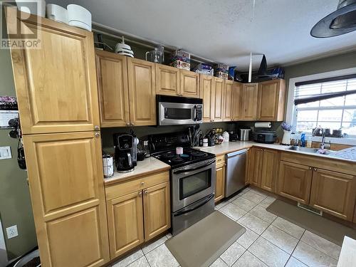 4403 Heritage Crescent, Fort Nelson, BC - Indoor Photo Showing Kitchen With Double Sink