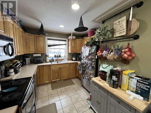 4403 Heritage Crescent, Fort Nelson, BC - Indoor Photo Showing Kitchen With Double Sink