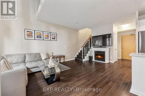 514 - 3939 Duke Of York Boulevard, Mississauga, ON - Indoor Photo Showing Living Room With Fireplace