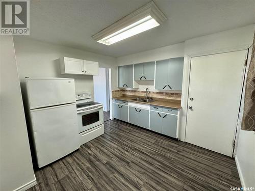 129 19Th Street E, Prince Albert, SK - Indoor Photo Showing Kitchen With Double Sink