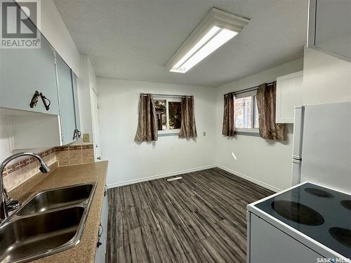 129 19Th Street E, Prince Albert, SK - Indoor Photo Showing Kitchen With Double Sink