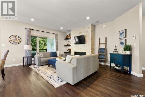 101 Motherwell Drive, White City, SK - Indoor Photo Showing Living Room With Fireplace