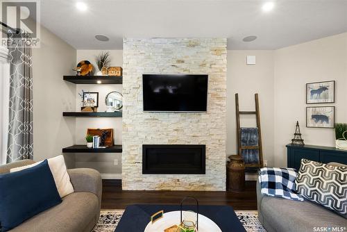 101 Motherwell Drive, White City, SK - Indoor Photo Showing Living Room With Fireplace