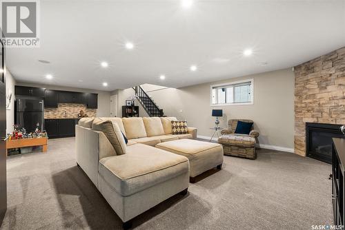 101 Motherwell Drive, White City, SK - Indoor Photo Showing Basement With Fireplace