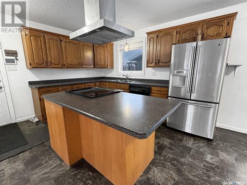 9408 Meadow Lark Lane, North Battleford, SK - Indoor Photo Showing Kitchen With Double Sink