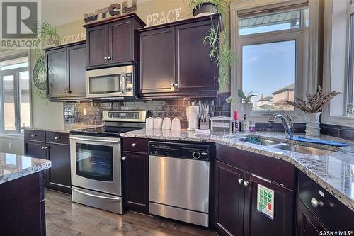 8013 Edgewater Bay, Regina, SK - Indoor Photo Showing Kitchen With Double Sink