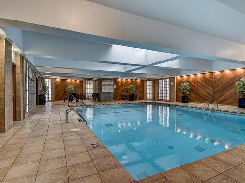 Piscine - 207-2555 Av. Du Havre-Des-Îles, Laval (Chomedey), QC - Indoor Photo Showing Other Room With In Ground Pool