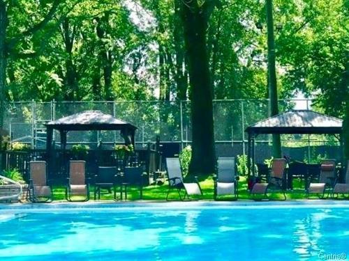 Piscine - 207-2555 Av. Du Havre-Des-Îles, Laval (Chomedey), QC - Outdoor With In Ground Pool