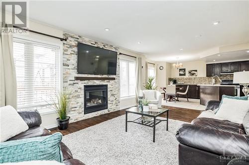 Gas fireplace - 26 Portadown Crescent, Ottawa, ON - Indoor Photo Showing Living Room With Fireplace