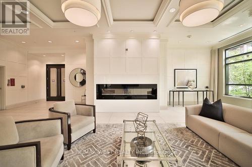 808 - 25 Fontenay Court, Toronto, ON - Indoor Photo Showing Living Room With Fireplace