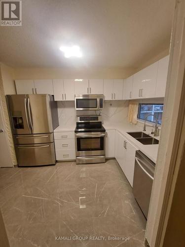 727 - 4645 Jane Street, Toronto, ON - Indoor Photo Showing Kitchen With Double Sink