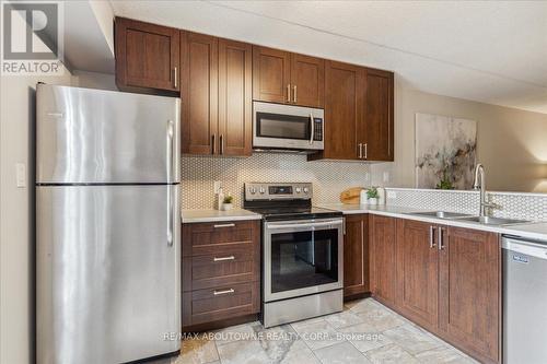 305 - 4005 Kilmer Drive, Burlington, ON - Indoor Photo Showing Kitchen With Double Sink