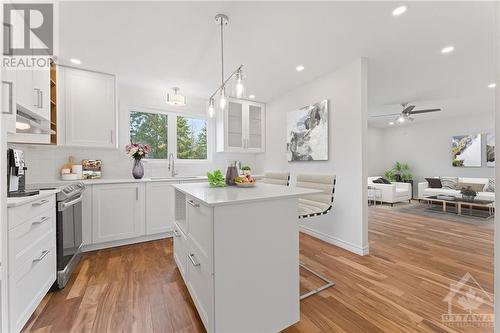 Family Room Virtually Staged - 70 Nestow Drive, Ottawa, ON - Indoor Photo Showing Kitchen With Upgraded Kitchen