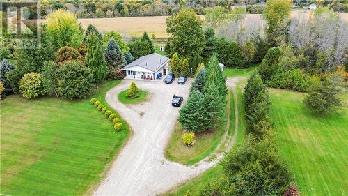 Property includes main driveway with round about and driveway to the right leading to separate entrance basement "in law suite" as well as garages, out buildings & large barn - 58 County Road 40 Road, Athens, ON - Outdoor With View