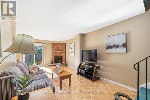 18 - 2655 Gananoque Drive, Mississauga, ON - Indoor Photo Showing Living Room With Fireplace