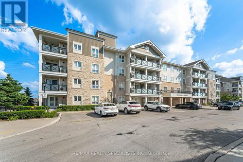 411 - 1005 Nadalin Heights, Milton, ON - Outdoor With Balcony With Facade