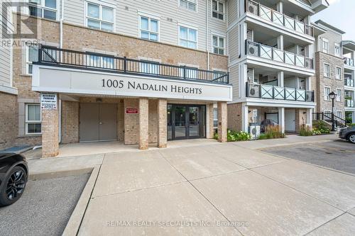 411 - 1005 Nadalin Heights, Milton, ON - Outdoor With Balcony With Facade