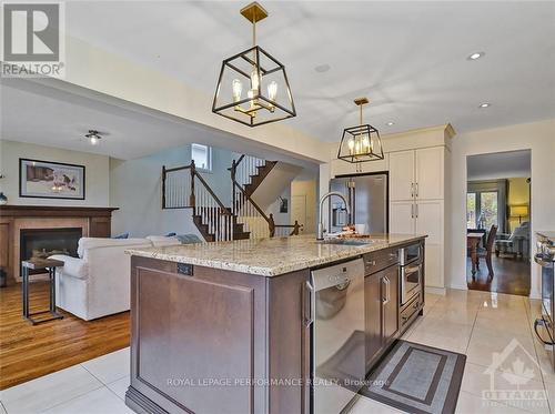 25 Campbell Court, Russell, ON - Indoor Photo Showing Kitchen With Fireplace