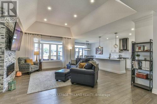 Open Concept Family Room, Kitchen and Dining - 88 Foxborough Place, Thames Centre (Thorndale), ON - Indoor Photo Showing Living Room With Fireplace