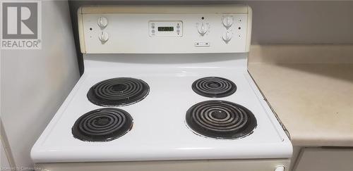 Interior details featuring electric stove - 76 Brybeck Crescent Unit# 105, Kitchener, ON - Indoor