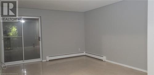 Empty room with a baseboard heating unit - 76 Brybeck Crescent Unit# 105, Kitchener, ON - Indoor Photo Showing Other Room