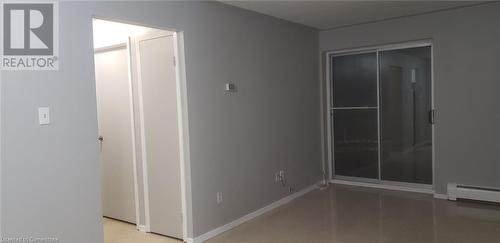 Spare room featuring a baseboard radiator - 76 Brybeck Crescent Unit# 105, Kitchener, ON - Indoor Photo Showing Other Room