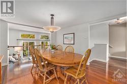 The large dining room overlooks the living room and has a view to the exterior. - 