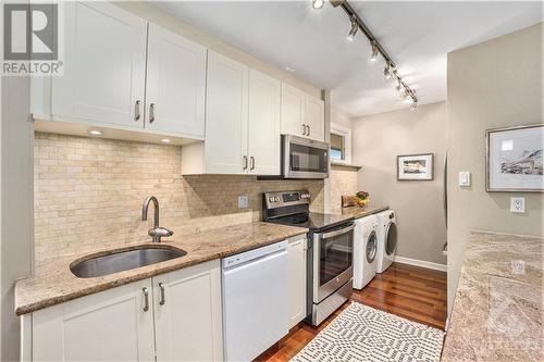 Contemporary design, good cupboard space and convenient laundry - 655 Richmond Road Unit#34, Ottawa, ON - Indoor Photo Showing Kitchen