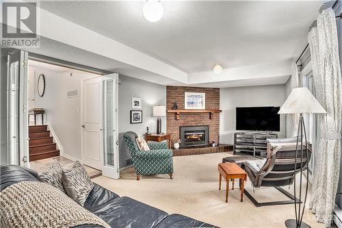 Walk-out family room with gas fireplace - 655 Richmond Road Unit#34, Ottawa, ON - Indoor Photo Showing Other Room With Fireplace