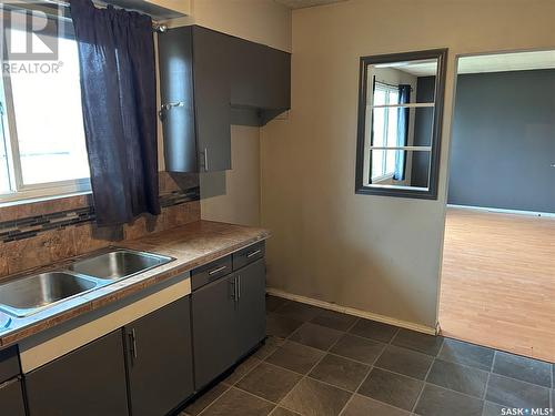 1191 110Th Street, North Battleford, SK - Indoor Photo Showing Kitchen With Double Sink