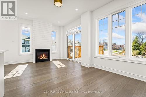 42 Little River Crossing, Wasaga Beach, ON - Indoor Photo Showing Living Room With Fireplace