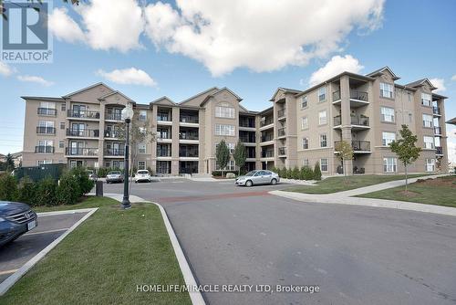 305 - 1380 Main Street E, Milton, ON - Outdoor With Balcony With Facade