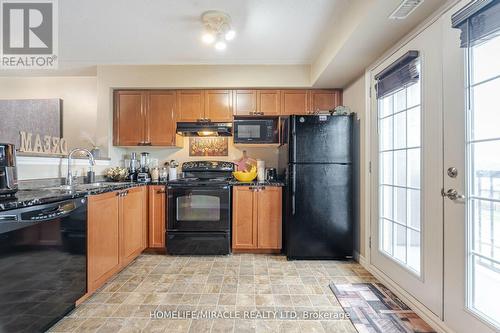 305 - 1380 Main Street E, Milton, ON - Indoor Photo Showing Kitchen With Double Sink