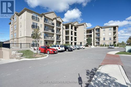 305 - 1380 Main Street E, Milton, ON - Outdoor With Balcony With Facade