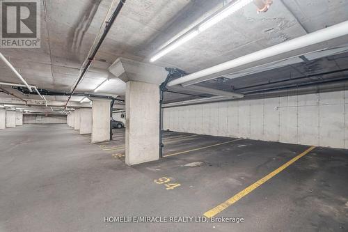 305 - 1380 Main Street E, Milton, ON - Indoor Photo Showing Garage