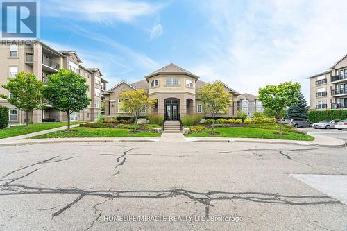 305 - 1380 Main Street E, Milton, ON - Outdoor With Facade