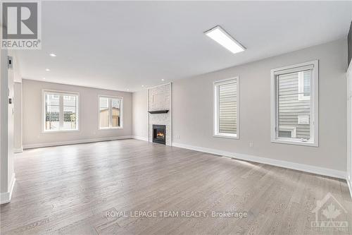 147 Equitation Circle, Ottawa, ON - Indoor Photo Showing Living Room With Fireplace