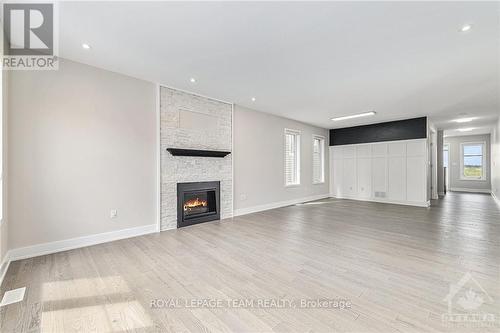 147 Equitation Circle, Ottawa, ON - Indoor Photo Showing Living Room With Fireplace