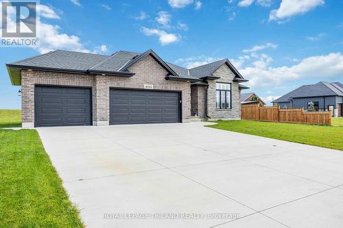 Front view of the concrete drive and 3 car garage - 4062 Van Bree Drive, Plympton-Wyoming (Plympton Wyoming), ON - Outdoor With Facade