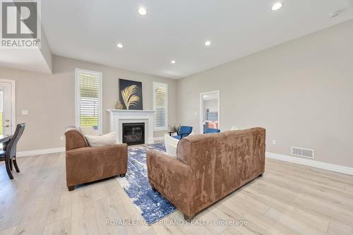 Living room with gas insert fireplace - 4062 Van Bree Drive, Plympton-Wyoming (Plympton Wyoming), ON - Indoor Photo Showing Living Room With Fireplace