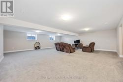 Huge family room in basement with large windows - 