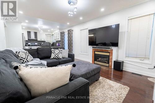 27 Grackle Trail, Toronto, ON - Indoor Photo Showing Living Room With Fireplace