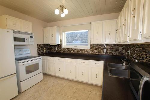 410 Patrick Avenue, The Pas, MB - Indoor Photo Showing Kitchen With Double Sink