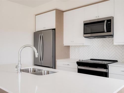 403-9716 Third St, Sidney, BC - Indoor Photo Showing Kitchen With Stainless Steel Kitchen With Double Sink With Upgraded Kitchen