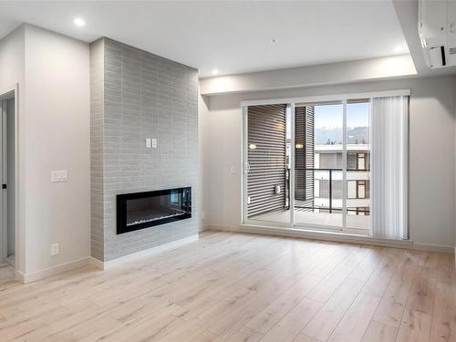 410-947 Whirlaway Cres, Langford, BC - Indoor Photo Showing Living Room With Fireplace