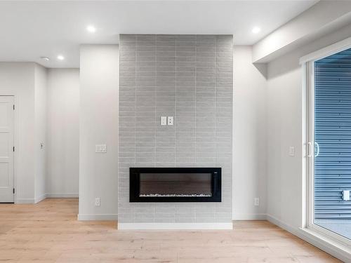 410-947 Whirlaway Cres, Langford, BC - Indoor Photo Showing Living Room With Fireplace