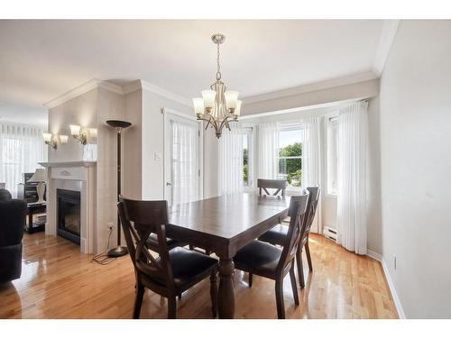 Dining room - 203-72 Boul. Des Hauts-Bois, Sainte-Julie, QC - Indoor Photo Showing Dining Room With Fireplace