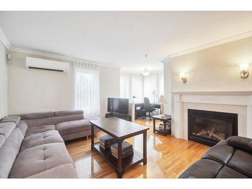 Living room - 203-72 Boul. Des Hauts-Bois, Sainte-Julie, QC - Indoor Photo Showing Living Room With Fireplace