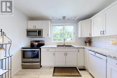 121 Queen Street, Kawartha Lakes, ON - Indoor Photo Showing Kitchen With Double Sink