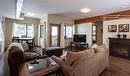 205-309 First Street, Revelstoke, BC  - Indoor Photo Showing Living Room With Fireplace 